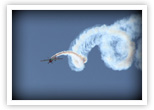 Aerobatic pilot Michael Goulian corkscrews during his routine