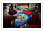 Monks from the Drepung Gomang Monastery in Tibet recreate a sand mandala.  A toddler ran through the mandala the day before and destroyed the monks&rsquo; work.  The monks were not angry, but had  compassion for the toddler and quietly started over.