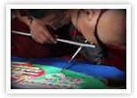 Monks from the Drepung Gomang Monastery in Tibet recreate a sand mandala.  A toddler ran through the mandala the day before and destroyed the monks&rsquo; work.  The monks were not angry, but had  compassion for the toddler and quietly started over.
